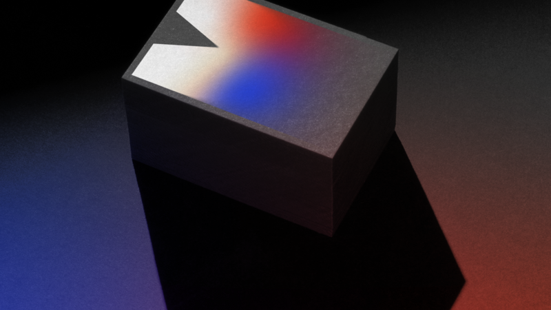 Printed business cards showing white ink printed on black cardstock